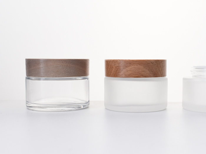 glass-cosmetic-jars-with-wooden-lids as skincare packaging